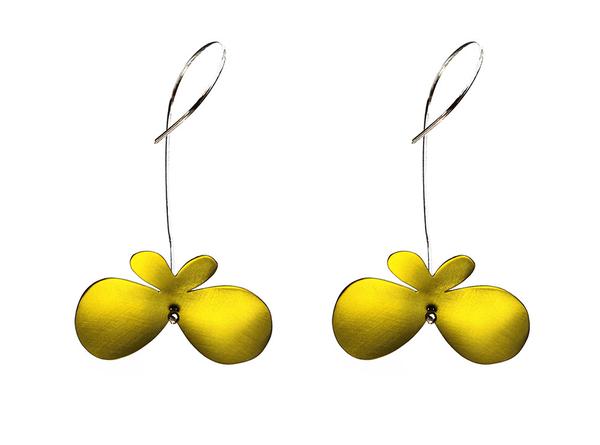 Butterfly earrings made of yellow titanium with long silver hooks.