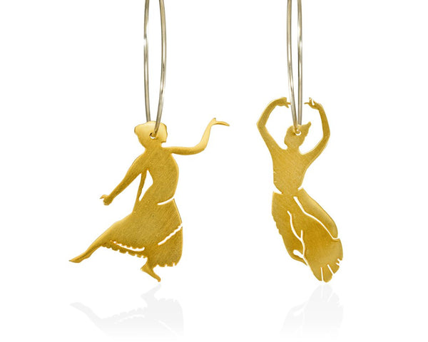 A couple of ladies dancing dressed up in an Indian palace. Hoop earrings made of gold-plated sterling silver