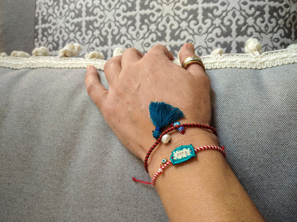 Handmade charm bracelets silk, fabric aand pearls, in blue and red shades