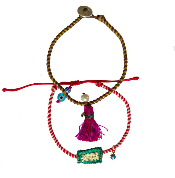 Set of charm bracelets made of silk strings with colorful ornaments in Fuchsia & Turquoise shades.
