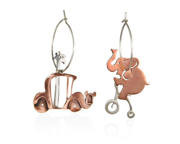 A giraffe so tall that her head is coming out of the roof of her car, randomly meets her best friend, the elephant, like a perfect acrobat riding his bike. Hoop sterling silver and copper earrings