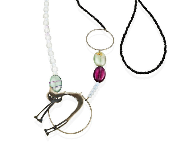 An enchant black cat. Green and purple flourite gem stones, moonstones and black glass beds mix and match in this long sterling silver necklace