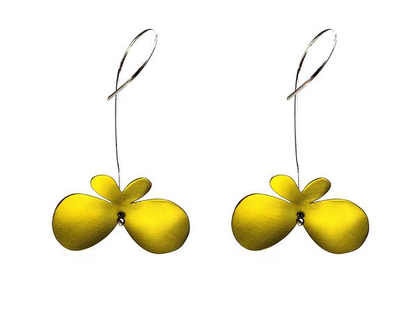 Butterfly earrings made of yellow titanium with long silver hooks.
