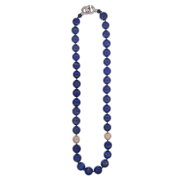 A necklace made of big lapis-lazuli round gems with two fresh-water pearls. A classic piece, yet stylish and creative. The platinum-plated silver clasp fills out the timeless design and can be worn in the back of the neck or in the front.